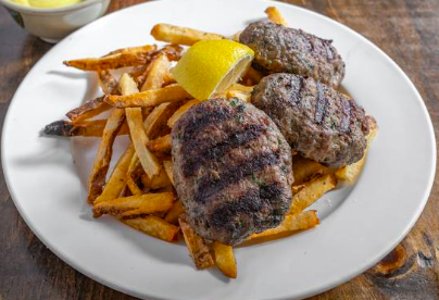 kiki's signature dishes Souvlaki Pita
Kiki's Bifteki
Souvlaki Platter